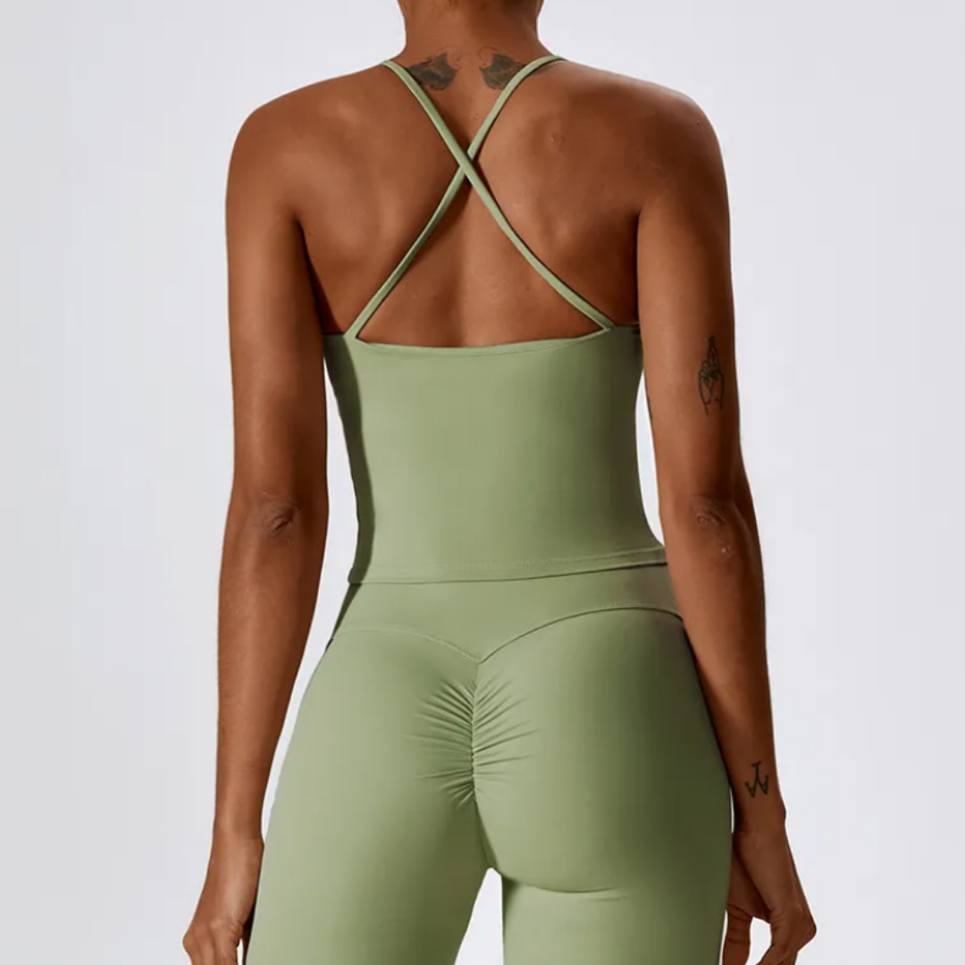 The Hera Singlet - Crafted from a blend of nylon and spandex, featuring removable pads and seamless elegance. Redefine your fitness experience with this activewear. Explore Hera now for unmatched comfort and personalized support.