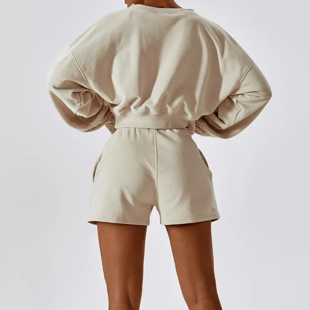 Crafted from a luxurious cotton/poly blend, this sweater provides a plush, cozy feel against your skin while ensuring durability for your active lifestyle. Embrace all-day comfort without compromising on style. The chic cropped design of the Samara Sweater adds a modern touch to the classic v-neck, making it a statement piece that exudes sophistication and charm. Built to last, this sweater is made with durable fabric, ready to withstand the demands of your busy life.