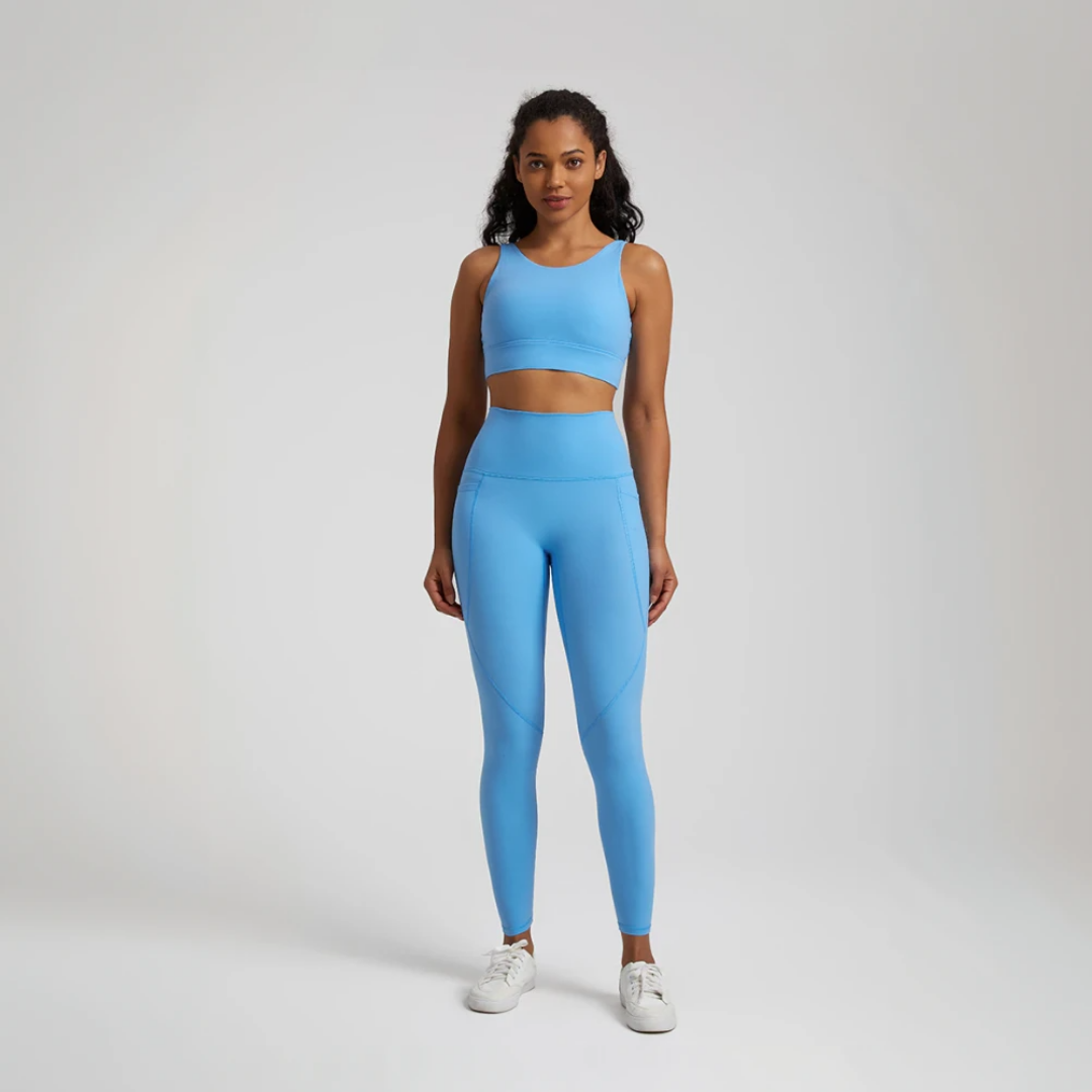 Women's two-piece gym set in breathable nylon/spandex blend. High-waisted leggings with seamless design for a flattering fit. Unique back design on sports bra adds style. Quick-drying material for comfort during workouts. Medium support and compression for unrestricted movement. Venus set - a must-have for any active woman's wardrobe.