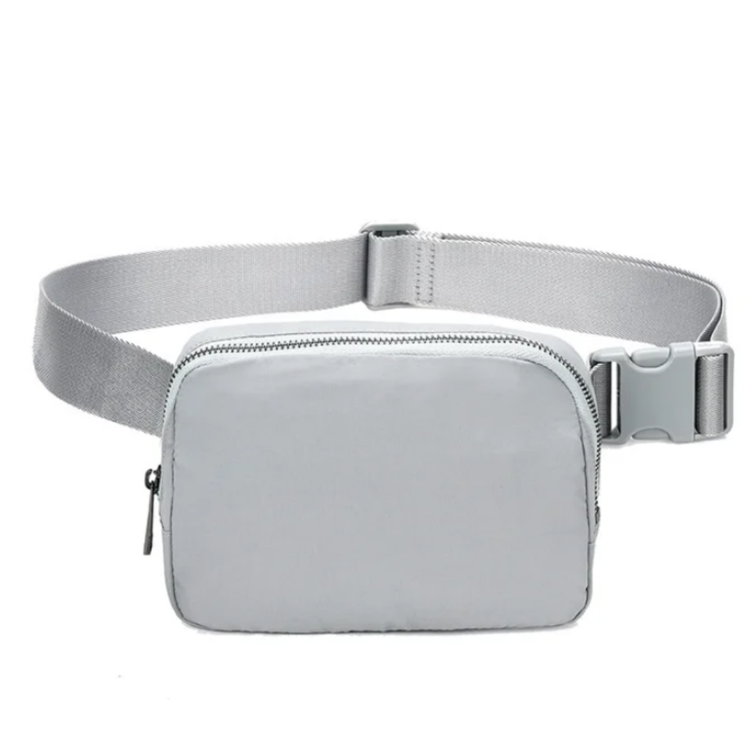 Adjustable Mini Waist Bag: Redefining On-the-Go Fashion with Compact Design, Adjustable Strap, and Secure Zip Closure. Experience Hands-Free Convenience Whether Worn Around the Waist or Crossbody. Petite Size (14cm x 20cm), Big Impact - Elevate Your Daily Adventures in Style. Explore Now!