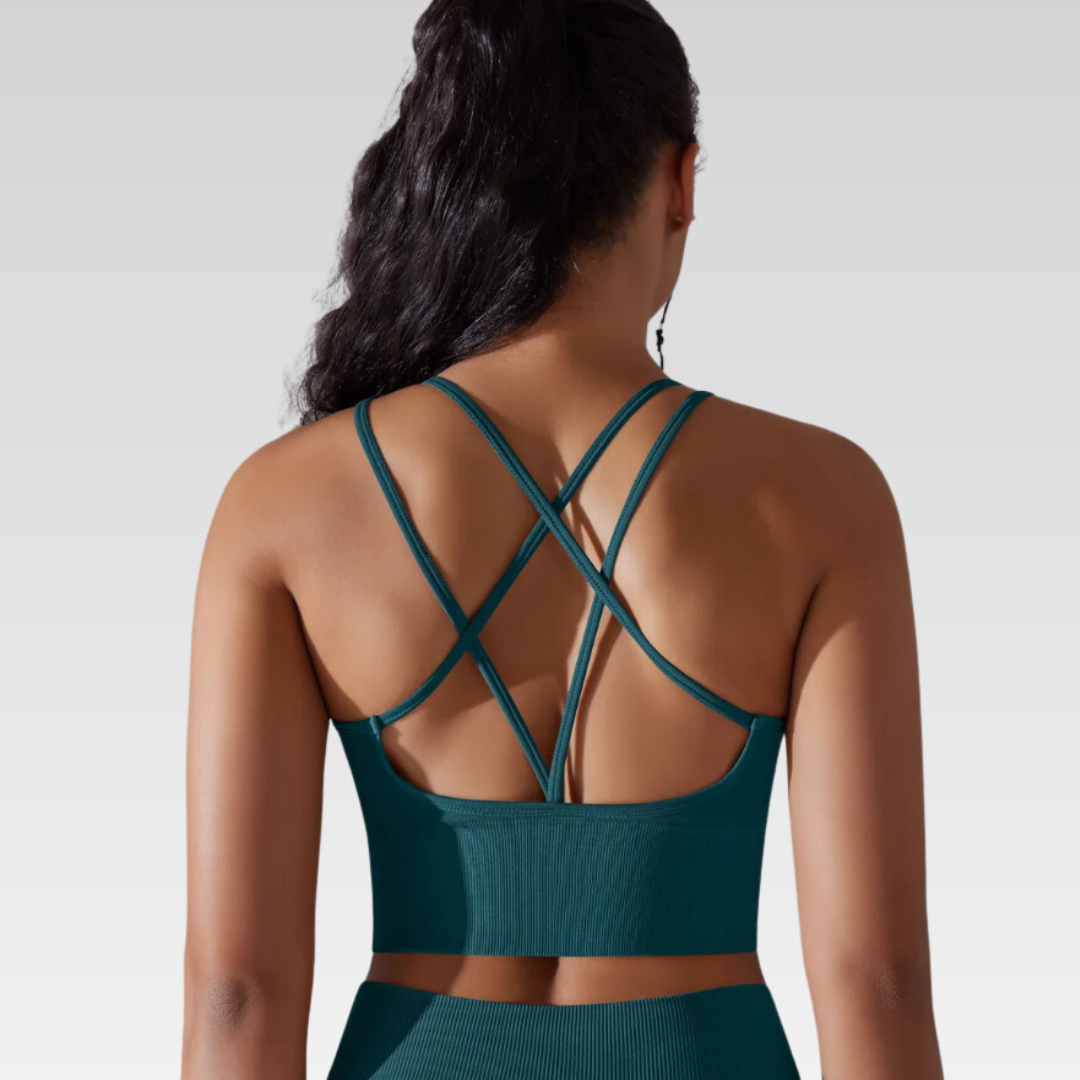Georgia Cross Back Sports Bra: Medium support for versatile workouts. Crafted from a nylon/spandex blend for flexibility and style. Breathable design for cool workouts and quick-dry technology for on-the-go convenience. Elevate your workout confidence with the Georgia Sports Bra.