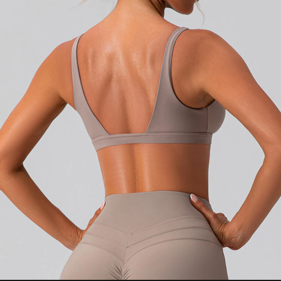Athena V-Neck Sports Bra – Style and comfort in one. Premium nylon blend for quick drying, breathable material, and durability. Sweat in style with confidence, knowing your sports bra works as hard as you do. Built to last, Athena Sports Bra is your perfect workout companion. Conquer your workouts with confidence – order today!