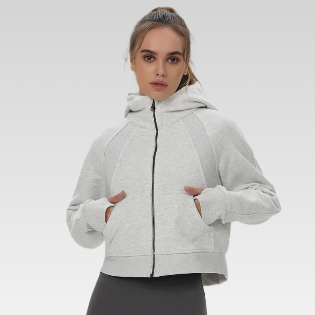Trendsetting Narissa Jacket - Cotton/poly mix, functional hoodie, pockets, thumb holes, zipper front, and cropped silhouette for style and comfort.