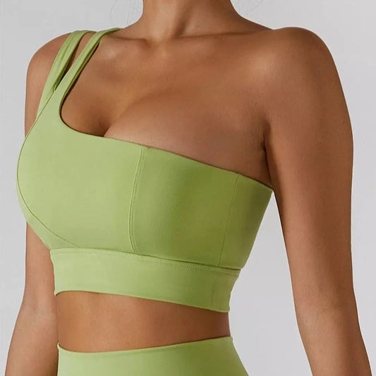 Demeter One Shoulder Sports Bra: Stylish and comfortable sports bra for your gym look. Composed of 75% nylon and 25% spandex for maximum comfort, durability, and sweat-wicking capabilities. Features include a comfortable fit, durable and stylish design, removable pads, and medium support. Complete your look with our Ophelia Skirt and Sports Bra Set or mix and match for a unique and upgraded workout outfit.