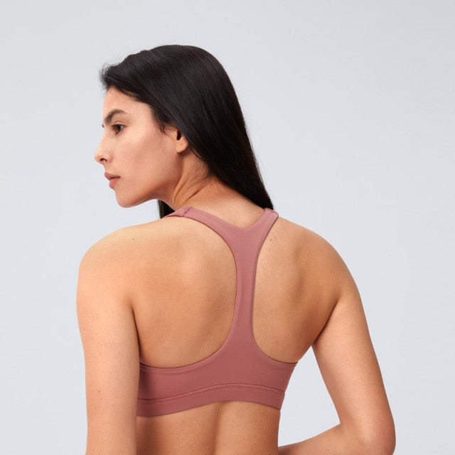 Amber Sports Bra – Ultimate comfort and style. Nylon/spandex blend for a buttery soft feel on your skin. Removable padding for customizable support. Durable material for tough workouts, made to withstand wash after wash. Stay cool and comfortable with the breathable design. Say goodbye to ill-fitting and chafing sports bras.