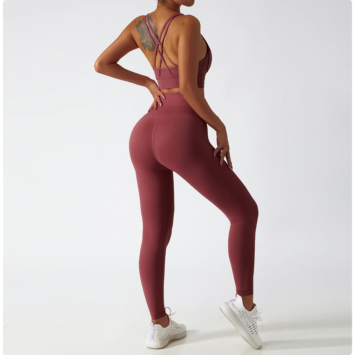 Women's Vitality Set in breathable nylon/spandex blend. Seamless high-waisted leggings for a flattering fit. Strappy sports bra with removable pads. Quick-drying material for comfort during workouts. Stylish and functional – a must-have for any active woman's wardrobe.