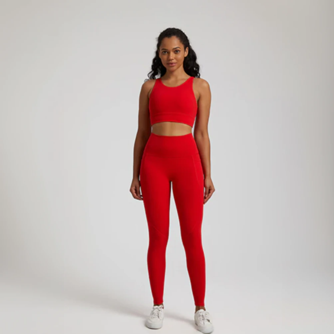 Women's two-piece gym set in breathable nylon/spandex blend. High-waisted leggings with seamless design for a flattering fit. Unique back design on sports bra adds style. Quick-drying material for comfort during workouts. Medium support and compression for unrestricted movement. Venus set - a must-have for any active woman's wardrobe.