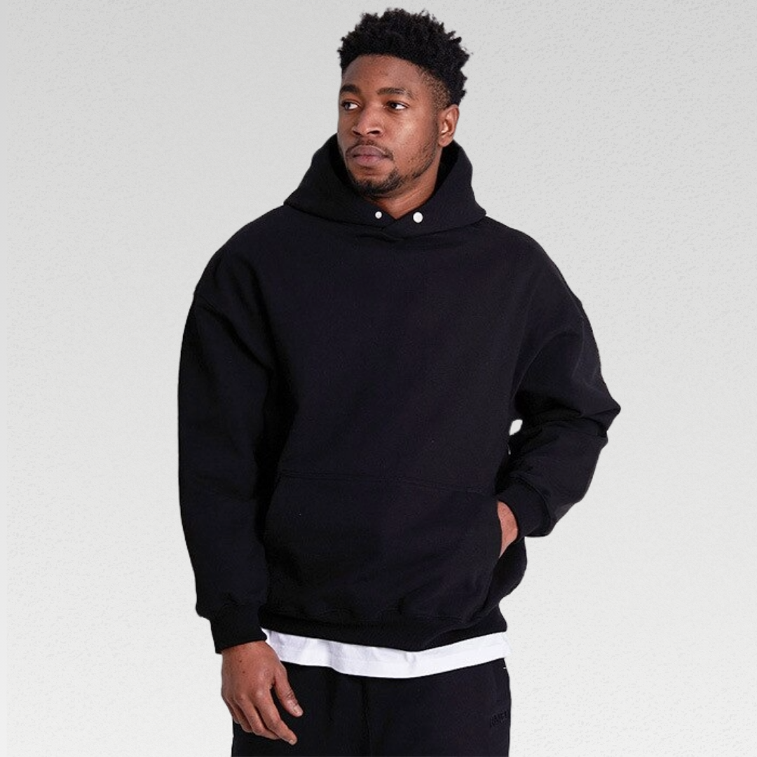 Durable and breathable men's hoodie made from premium cotton fabric, perfect for rest days or gym sessions, featuring an oversized fit, large hood, and front pocket for ultimate comfort and style.