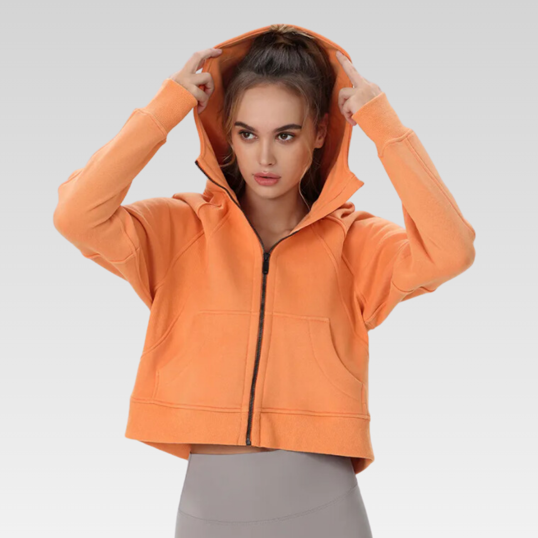 Trendsetting Narissa Jacket - Cotton/poly mix, functional hoodie, pockets, thumb holes, zipper front, and cropped silhouette for style and comfort.