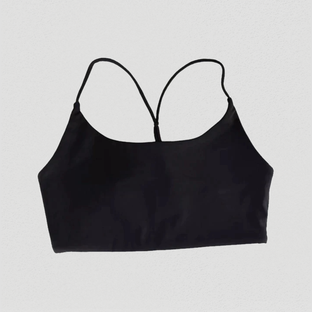 Amelia Sports Bra – Functionality meets fashion. Premium Nylon/Lycra blend for maximum comfort. Minimalist elegant back details for a stylish touch. Soft, stretchy fabric conforms to your body with removable pads for customizable support. Sweat-wicking fabric keeps you cool and dry during workouts. Embrace comfort, style, and functionality with the Amelia Sports Bra.