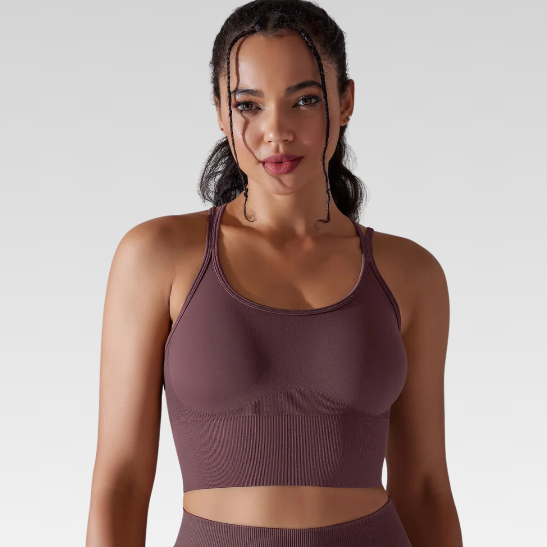 Georgia Cross Back Sports Bra: Medium support for versatile workouts. Crafted from a nylon/spandex blend for flexibility and style. Breathable design for cool workouts and quick-dry technology for on-the-go convenience. Elevate your workout confidence with the Georgia Sports Bra.