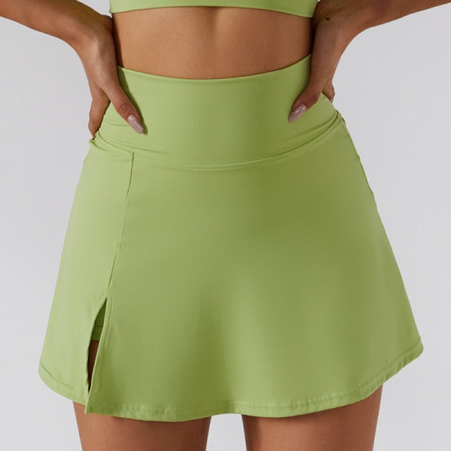 Demeter Tennis Skirt Set - Elevate your sports style with this two-piece activewear set. The high waisted tennis skirt with privacy shorts and one-shoulder sports bra provide maximum comfort, breathability, and durability for tennis, golf, running, and more. Made from a high-quality nylon/spandex blend.