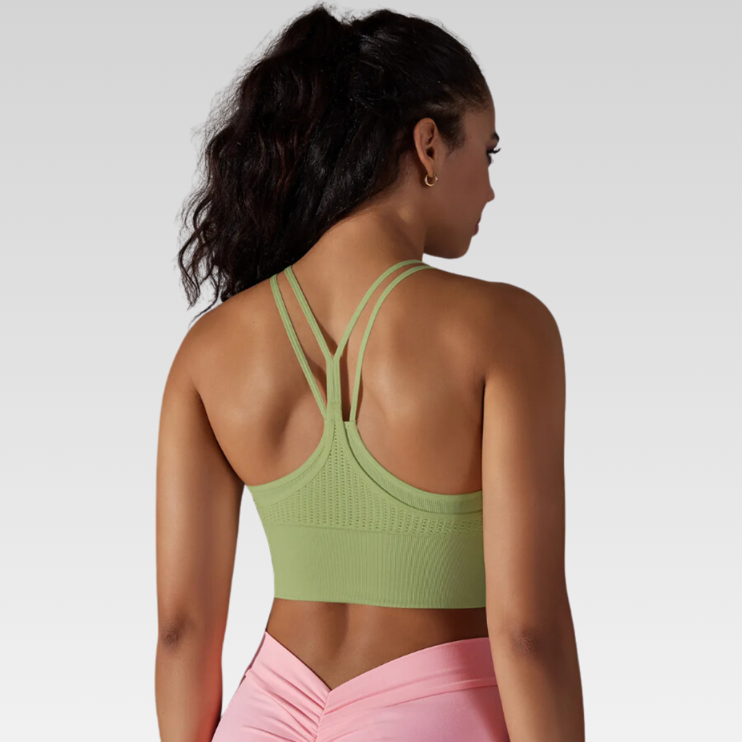 Andorra Yoga Singlet – Comfort and style redefined. Premium nylon/spandex blend for ultimate flexibility and a soft touch. Breathable design for a refreshing flow in your yoga practice. Built-in sports bra for seamless support. Versatile style transitions effortlessly from the mat to everyday life. Elevate your yoga experience with the Andorra Singlet.