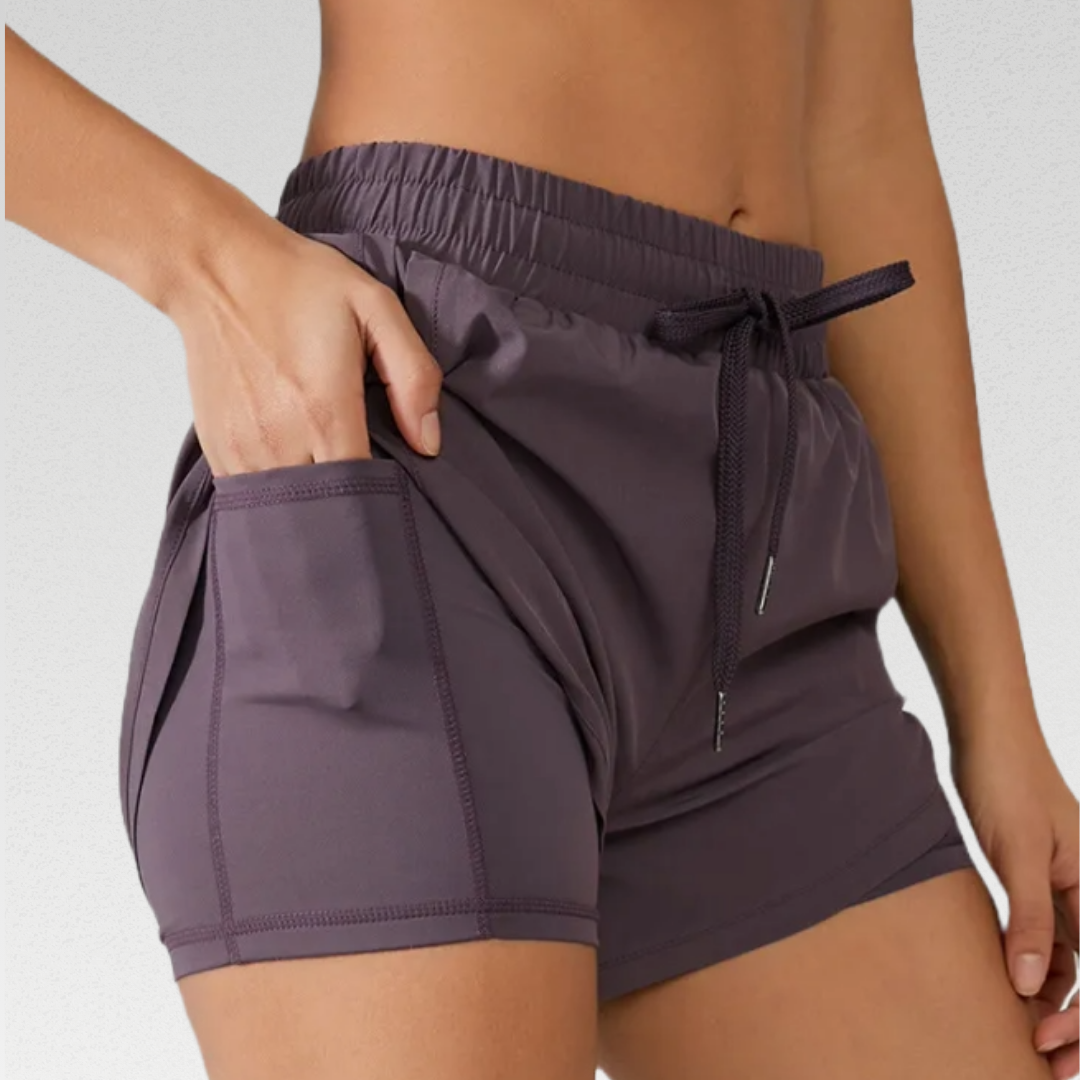 Dakota Running Shorts: Experience a new level of comfort and functionality. Tailored for performance and style, crafted from a premium nylon/lycra blend for flexibility and durability. Elastic drawstring waistband for a comfortable and secure fit during all-day runs. Interior fitted shorts with a pocket for convenient storage of essentials. Elevate your running experience with the perfect blend of comfort and functionality.