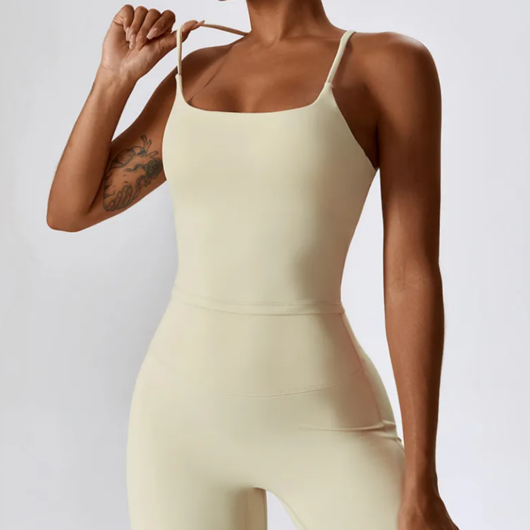 The Hera Singlet - Crafted from a blend of nylon and spandex, featuring removable pads and seamless elegance. Redefine your fitness experience with this activewear. Explore Hera now for unmatched comfort and personalized support.