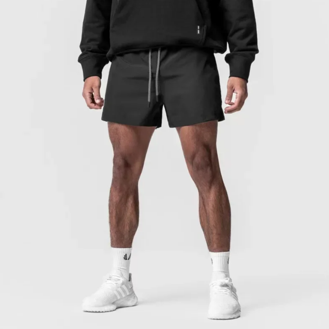 The Isaiah Shorts - Crafted from a Nylon/Poly blend for ultimate comfort. Adjustable drawstring waist, functional pockets, and a belt loop for added convenience. Elevate your casual wardrobe with these stylish and comfortable shorts.