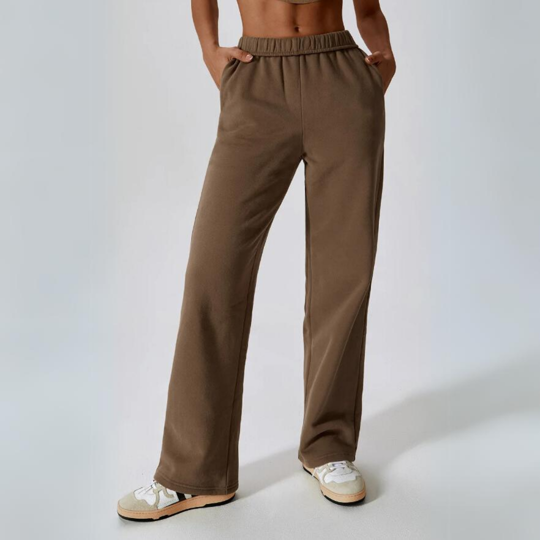 Kira Sweatpants - Elevate your loungewear game with these cozy cotton sweatpants. Featuring an elastic waistband and functional pockets for supreme comfort and everyday convenience.