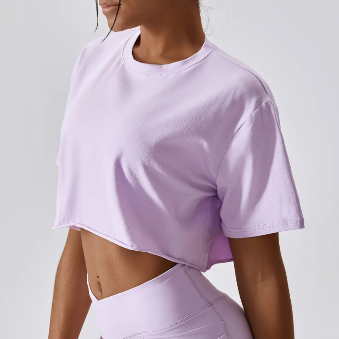 The Cali Cropped Crew Neck Tee, showcasing unparalleled comfort in a blend of cotton and spandex. Experience breathable comfort, quick-dry technology, and durable style effortlessly blended in this versatile tee for any occasion.