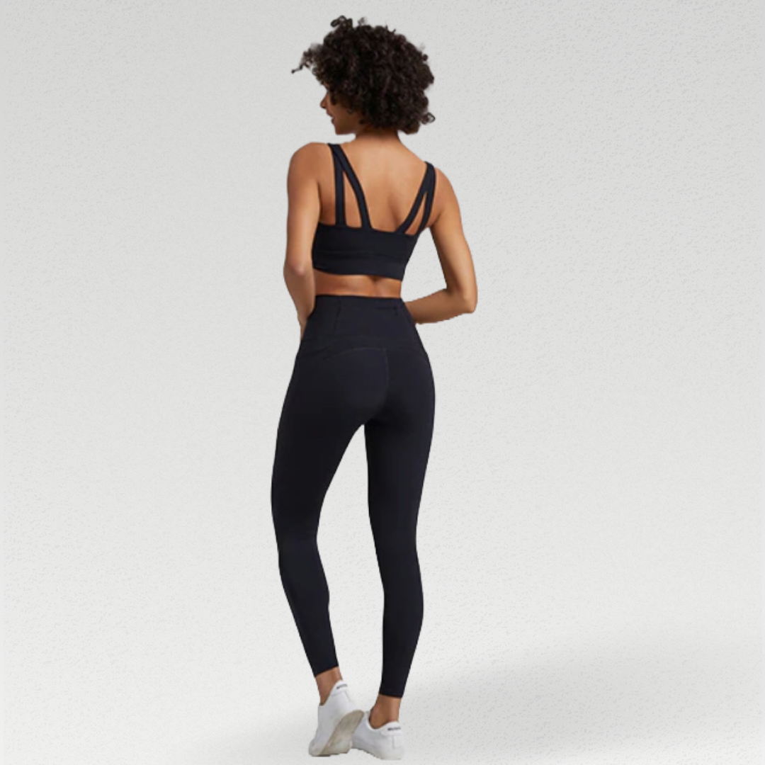 Women's two-piece gym set in breathable nylon/spandex blend. High-waisted leggings with seamless design for a flattering fit. Unique back design on sports bra adds style. Quick-drying material for comfort during workouts. Medium support and compression for unrestricted movement. Venus set - a must-have for any active woman's wardrobe.
