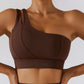 Demeter One Shoulder Sports Bra: Stylish and comfortable sports bra for your gym look. Composed of 75% nylon and 25% spandex for maximum comfort, durability, and sweat-wicking capabilities. Features include a comfortable fit, durable and stylish design, removable pads, and medium support. Complete your look with our Ophelia Skirt and Sports Bra Set or mix and match for a unique and upgraded workout outfit.