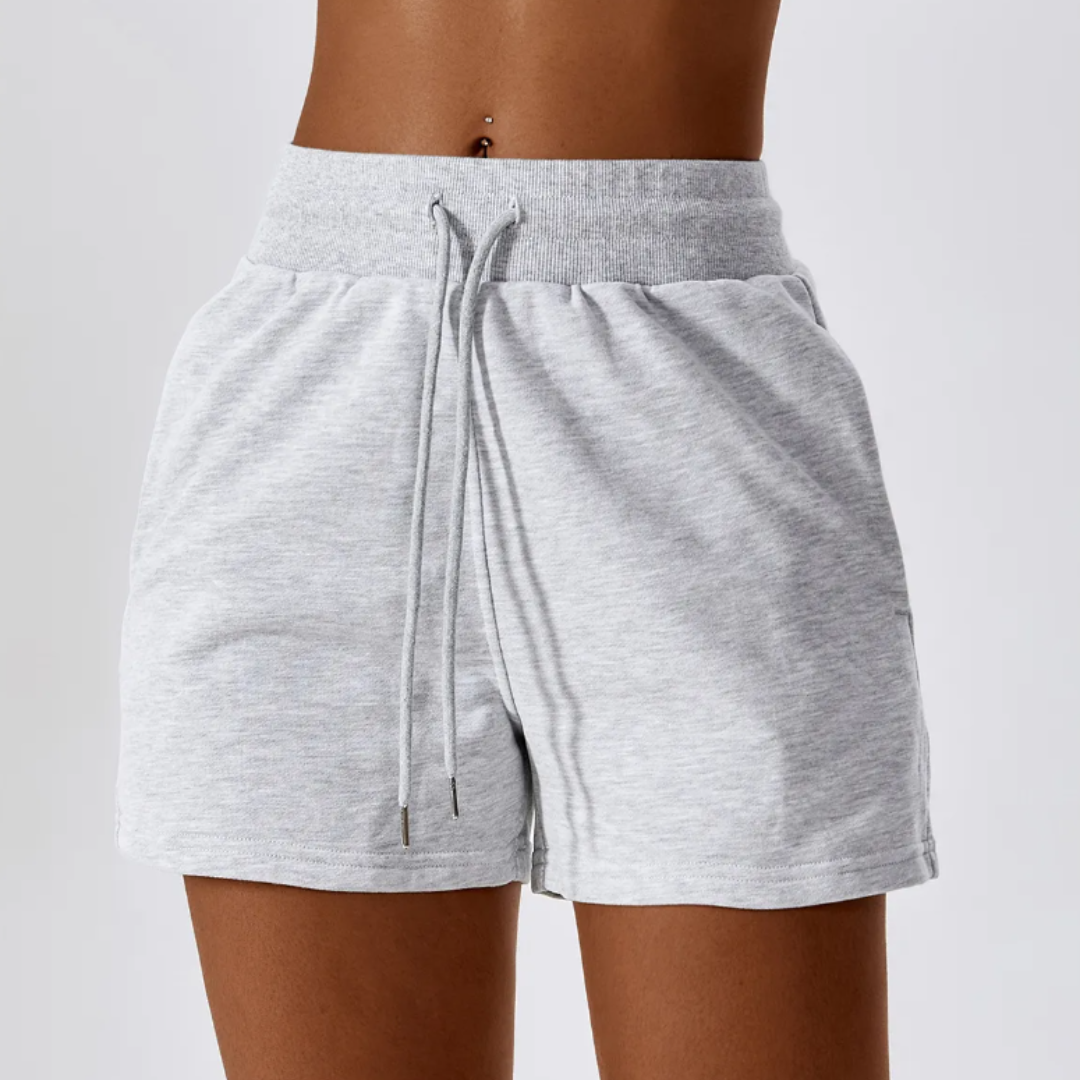 Made from a premium cotton/poly blend, these shorts offer a plush, cozy feel against your skin while ensuring durability for your active lifestyle. Enjoy all-day comfort without compromising on style. Built to last, the Samara Shorts are designed with durable fabric, ready to withstand the demands of your busy life. Whether you're relaxing at home or heading out for errands or brunch with friends, the Samara Shorts are your go-to choice for comfort and style.