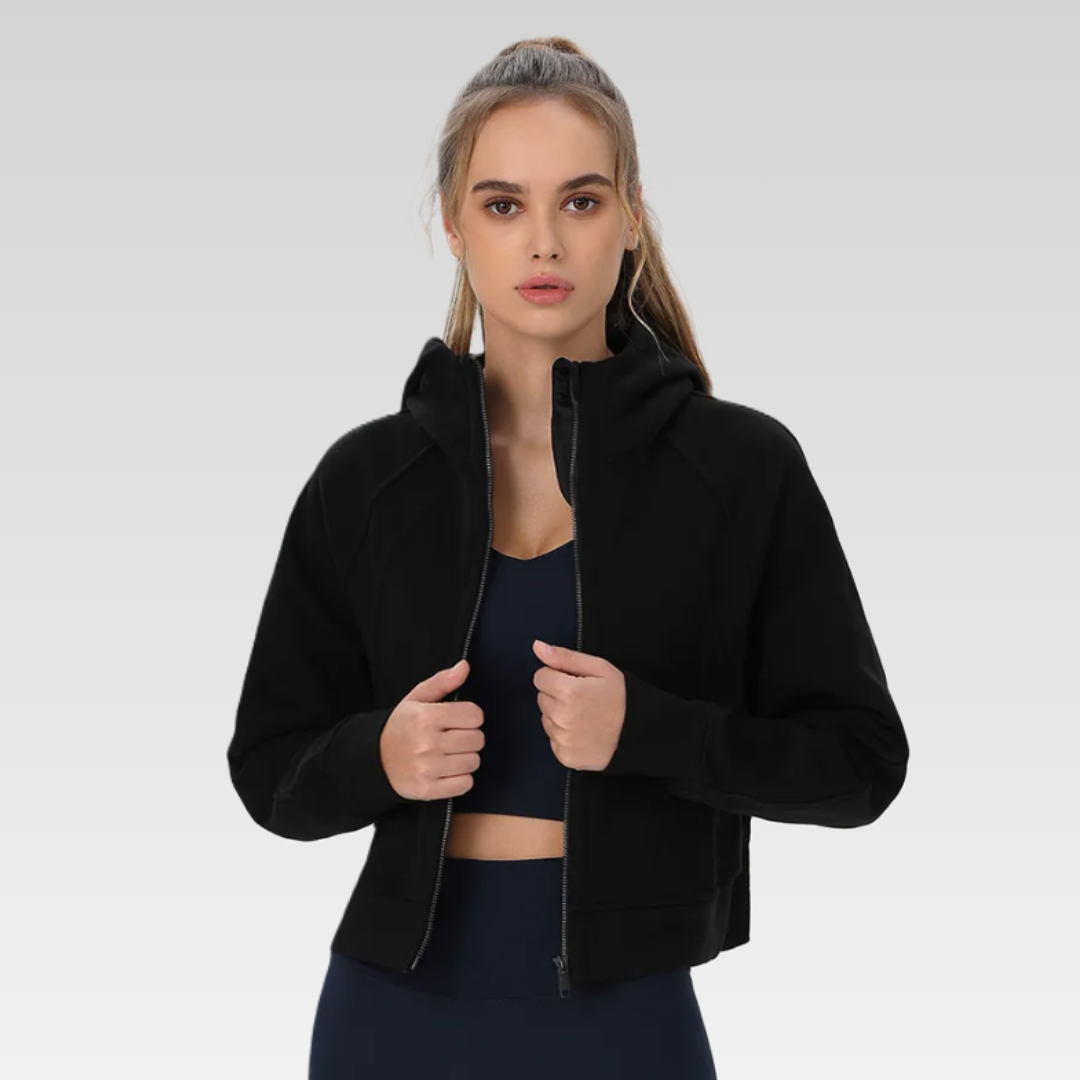 Trendsetting Narissa Jacket - Cotton/poly mix, functional hoodie, pockets, thumb holes, zipper front, and cropped silhouette for style and comfort.