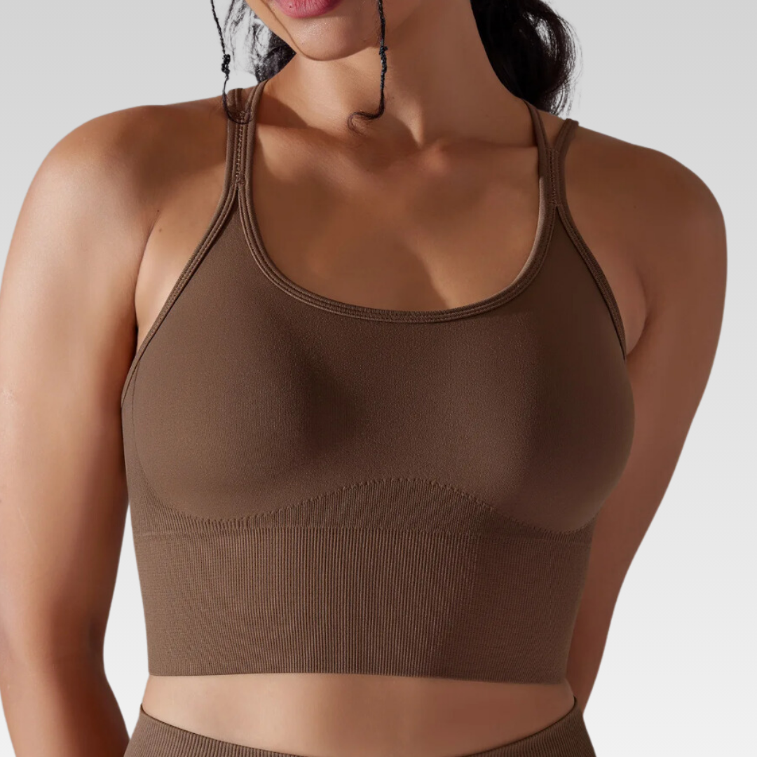 Georgia Cross Back Sports Bra: Medium support for versatile workouts. Crafted from a nylon/spandex blend for flexibility and style. Breathable design for cool workouts and quick-dry technology for on-the-go convenience. Elevate your workout confidence with the Georgia Sports Bra.