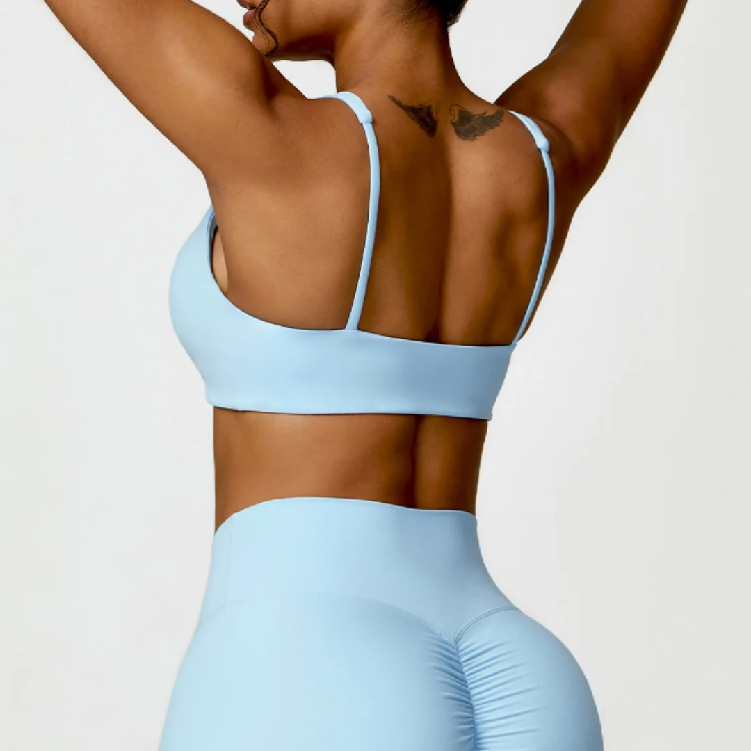 The Adelaide Sports Bra – Premium nylon/spandex blend, quick-dry technology, breathable design, removable pads, and medium support. Elevate your activewear with ultimate comfort and customizable features for a stylish and functional workout experience.