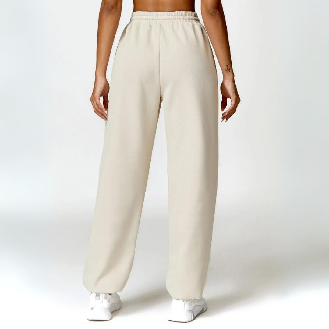 Talena Sweatpants - Premium cotton/poly blend for ultimate softness and durability. Elastic drawstring waistband for tailored comfort. Cuffed ankles for stylish versatility. Elevate your loungewear experience with the cozy and chic Talena Sweatpants.