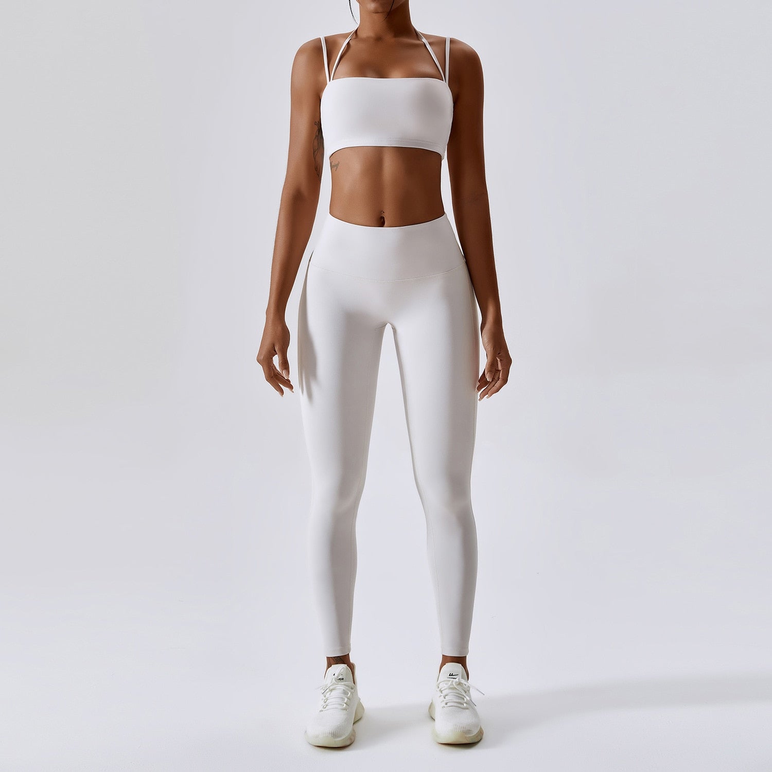Ember Set - Elevate your fitness fashion with this stylish and functional two-piece activewear set. Made from a durable nylon/spandex blend, the set includes a sports bra with removable pads and high-waisted leggings. Stay comfortable, dry, and fashionable during your workout. Order now and ignite your fitness journey!