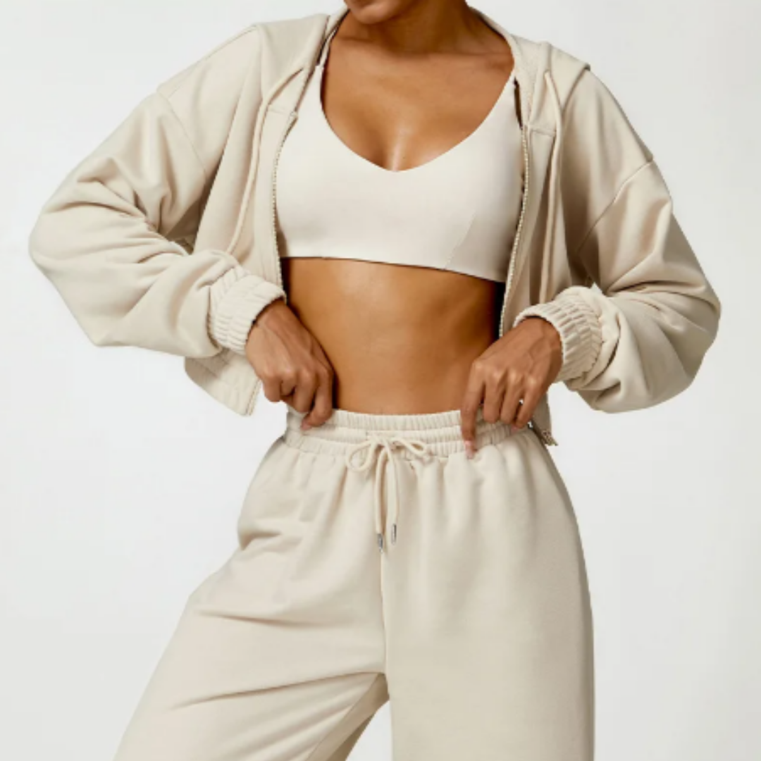 Talena Hoodie - Premium cotton/poly blend for durability and softness. Drawstring hood for personalized comfort. Trendsetting cropped silhouette for a chic and fashionable look. Elevate your style with the perfect blend of fashion and functionality.