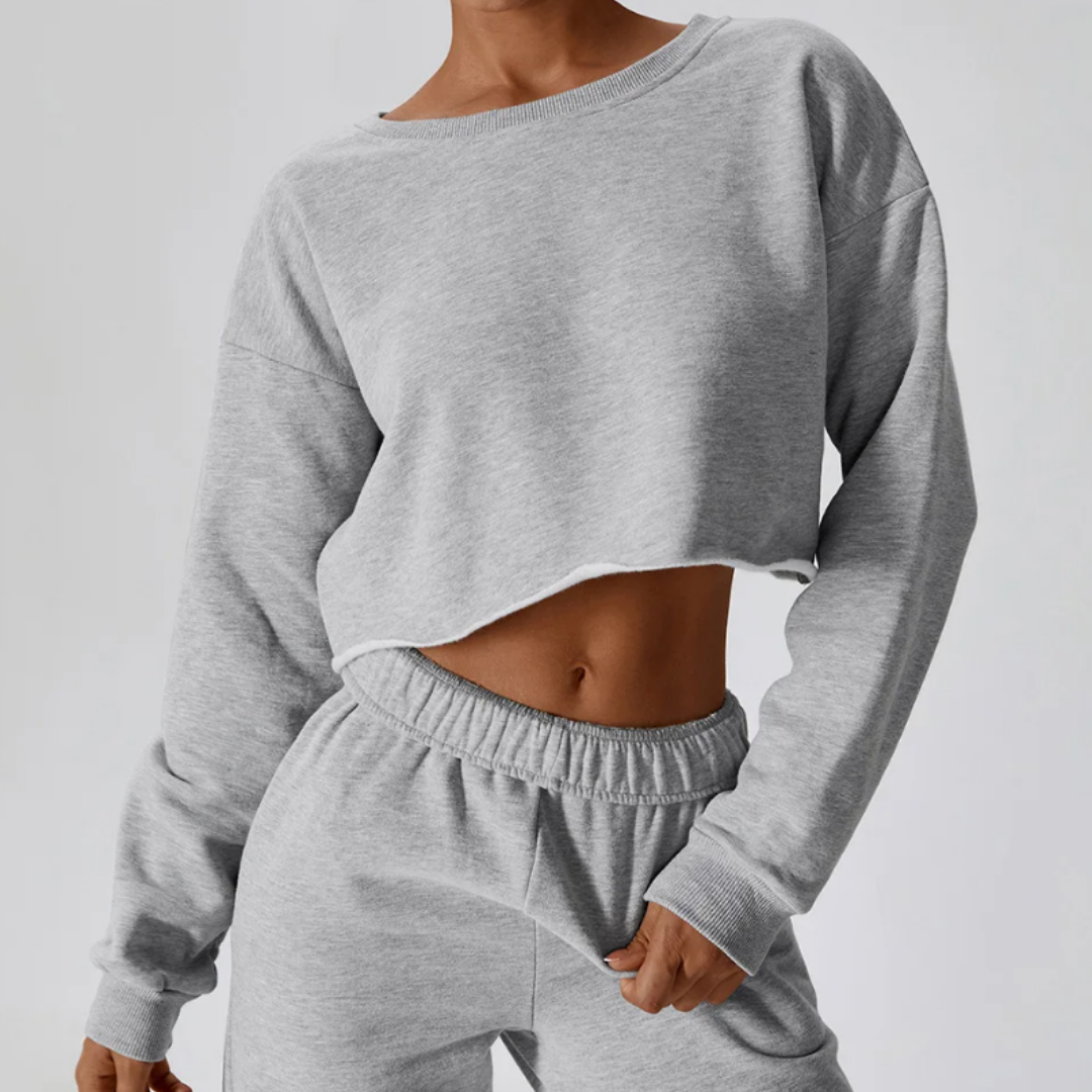 Kira Long Sleeve Shirt: Elevate Loungewear with Comfort and Style - Raw Hem Detail, Cropped Design, and Cotton Comfort for Effortless Chic in Every Moment. From Relaxed Lounging to Active Pursuits, Embrace Versatility in Your Wardrobe.