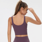 Amalfi Cropped Singlet – Style meets high-performance functionality. Built-in sports bra with removable pads for ultimate support and customization. Breathable nylon fabric keeps you cool during workouts. Cropped design adds elegance and freedom of movement to your active lifestyle. Elevate your style and performance with the perfect blend of comfort and support.