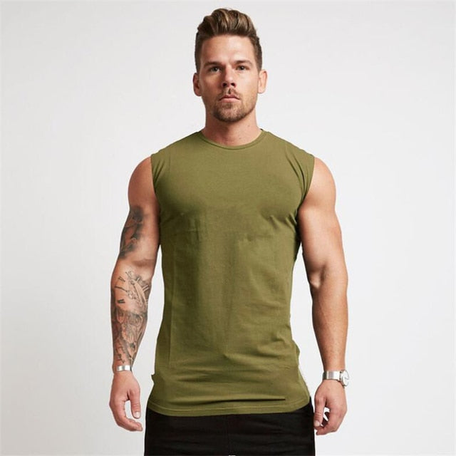 Upgrade your gym wardrobe with our Hero Sleeveless Tee, a premium blend of high-quality broadcloth and cotton for a comfortable fit. This versatile and stylish shirt is perfect for various activities, providing maximum comfort and durability during your workouts. Feel confident and look great whether you're hitting the gym, running errands, or relaxing at home.