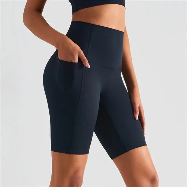 Back to Basics Women's Workout Shorts - High-quality Nylon/Spandex blend for comfort and durability. Sweat-wicking and breathable material keeps you cool and dry during workouts. Versatile for gym sessions, running, cycling, yoga, or lounging. Designed to last, saving you money in the long run. Stay comfortable and stylish in these buttery-soft workout shorts, perfect for your summer wardrobe.