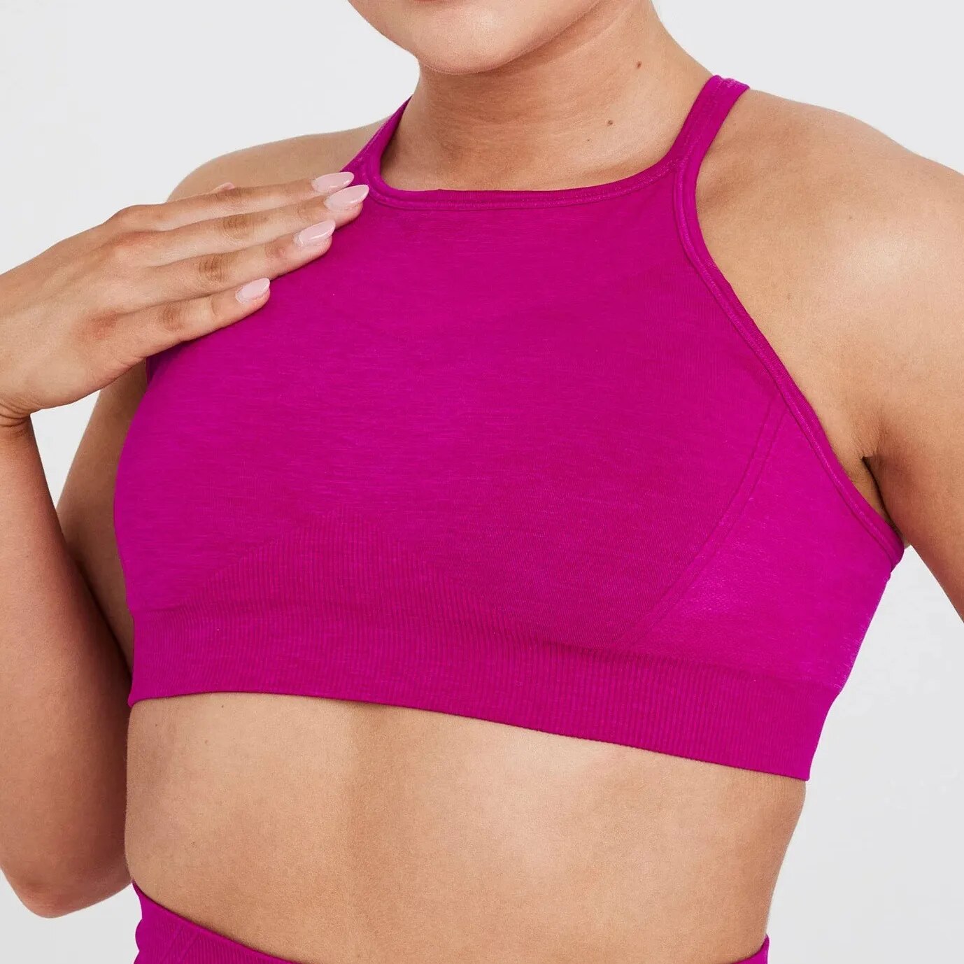 High Neck Sports Bra: Experience maximum support in athletic fashion. High-performance nylon/spandex blend for comfort, flexibility, and durability. Breathable design and quick-dry technology for a cool and confident workout. Seamless comfort with a friction-minimizing design for high-intensity workouts.
