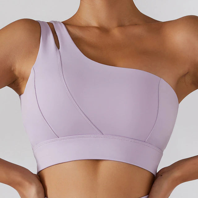 Demeter One Shoulder Sports Bra: Stylish and comfortable sports bra for your gym look. Composed of 75% nylon and 25% spandex for maximum comfort, durability, and sweat-wicking capabilities. Features include a comfortable fit, durable and stylish design, removable pads, and medium support. Complete your look with our Ophelia Skirt and Sports Bra Set or mix and match for a unique and upgraded workout outfit.