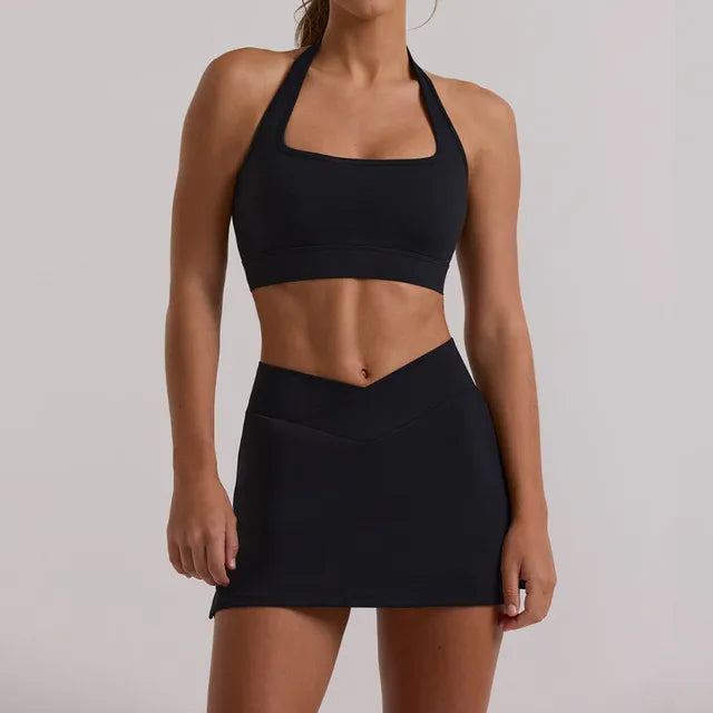 Lucinda Halter and Skort Set: Elevate Your Activewear with Fashion-Forward Design and High-Performance Functionality - Breathable Comfort, Innovative Skort Design with Cross-Over Waist, and Halter Neck Sports Bra for Support and Style. Conquer Your Fitness Goals in the Perfect Fusion of Fashion and Function.