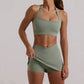 Lucinda Halter and Skort Set: Elevate Your Activewear with Fashion-Forward Design and High-Performance Functionality - Breathable Comfort, Innovative Skort Design with Cross-Over Waist, and Halter Neck Sports Bra for Support and Style. Conquer Your Fitness Goals in the Perfect Fusion of Fashion and Function.