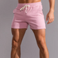 Cambridge Men's Shorts: Premium breathable cotton for cool comfort at home or on the go. Mid-length gym shorts with sweat-wicking material to keep you fresh during workouts or errands. Durable fabric ensures longevity. 3 pockets, drawstring waistband, and sweat-proof design make these shorts perfect for workouts or lounging.